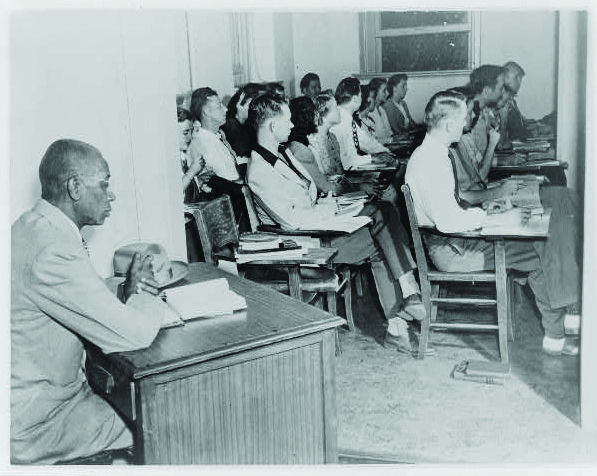 George McLaurin - desk in hallway at OK Univ